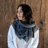 Model wearing 100% Cashmere naturally dyed Scarf by Tavy Tavy in charcoal dark grey